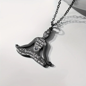 Black stainless steel yoga meditation pendant necklace with inspirational quote on white background