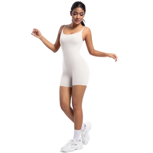 Detailed full-body shot of cream yoga bodysuit with sleeveless U-neck and matte fabric