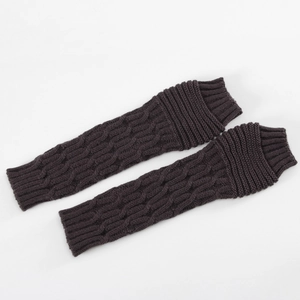 Detail of dark brown knitted arm warmers featuring a classic cable knit texture pattern
