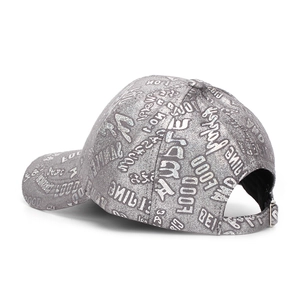Detail view of the silver glitter letters and adjustable metal buckle on the grey cap