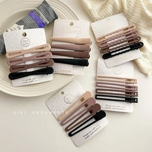 Close-up of matte Morandi colored hair clips set on elegant display cards