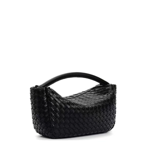 Detail of premium black woven leather mini handbag with sophisticated knot handle