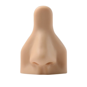 Realistic flesh-toned silicone nose model for piercing practice and jewelry display