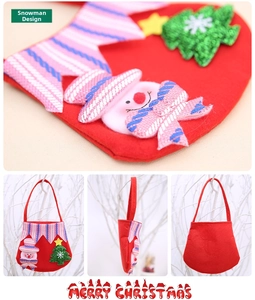 Detail of red felt Christmas candy bag with 3D snowman and sequined tree design