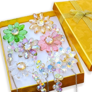 Golden gift box set containing colorful crystal flower suncatchers with hanging chains