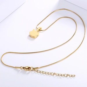 Polished gold stainless steel guitar pendant necklace with sleek snake chain on white
