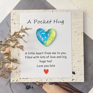 Detail of glitter gradient resin heart on A Pocket Hug greeting card with dried flowers