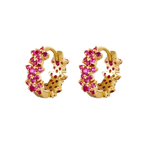 Detail of gold-plated huggie earrings with pavé set pink and red cubic zirconia