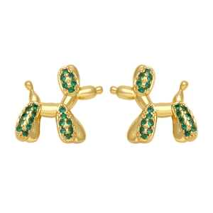 Detailed close-up of golden balloon dog earrings featuring green crystal pavé setting