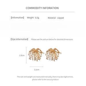 Detailed view of gold tassel earrings with dimensions 2.8cm x 3.1cm and 6.5g weight info