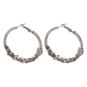 Silver geometric hoop earrings with sparkling textured faceted metal grain design