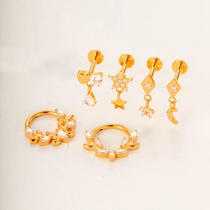 Titanium piercing set with gold heart and star studs and hoops with clear zircon stones