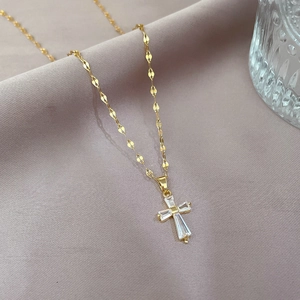 Detailed close-up of a titanium steel cross pendant with micro-inlaid square crystals