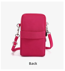 Rear view of rose red nylon phone bag showing zipper compartment and metal hooks