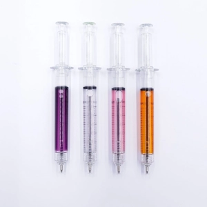 Set of four syringe shaped ballpoint pens with colorful liquid fillings on white backdrop
