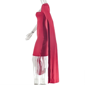 Detail view of red slim-fit mini dress featuring unique long cape sleeves and sleek fabric