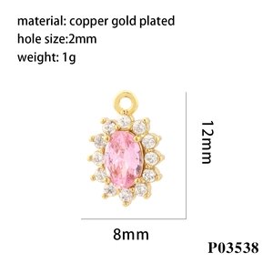 Detailed view of an 18K gold plated copper oval pendant with pink zircon and 2mm hole