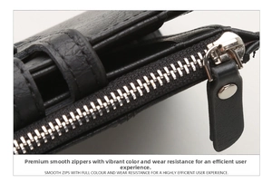 Macro shot of durable metal zipper on a black pebble grain leather wallet with stitching