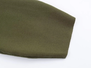 Detail of army green knitted cardigan showing fine ribbed texture and premium fabric weave
