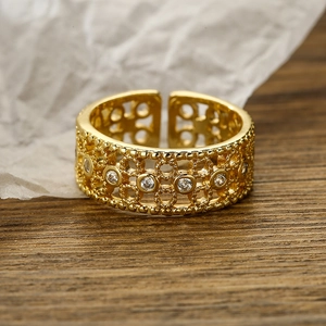 Vintage gold-plated adjustable ring featuring hollow-out design and white zircons