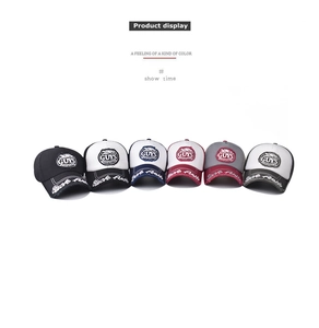 Detail view of retro GUYS cotton baseball caps in six different color combinations