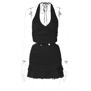 Detail view of black V-neck halter top and ruffled mini skirt set on a mannequin