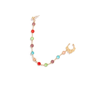 Detailed view of golden punk nose-to-ear chain featuring colorful synthetic gemstones