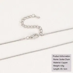 Detail view of silver snake chain necklace with lobster clasp and adjustable extension