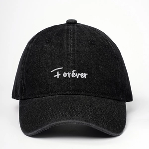 Adjustable black washed denim baseball cap with white Forever embroidery in a casual style