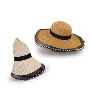 Women's straw sun hat with elegant black mesh brim and decorative white pearls detail