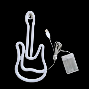 Detail of guitar neon sign showing dual USB and battery box power supply design
