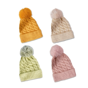 Chic cable knit winter hats in four pastel colors with fluffy faux fur pom poms on top