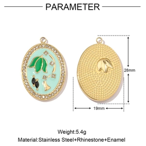 Oval stainless steel pendant with mint green enamel, gold bamboo design and rhinestones