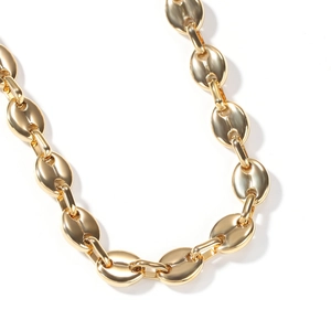 Macro view of gold stainless steel coffee bean chain with high polish finish