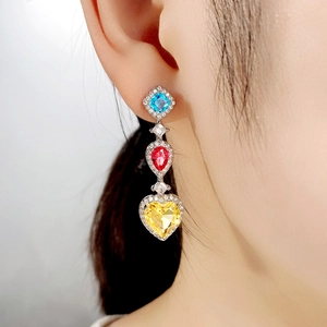 Colorful zircon drop earrings featuring blue square, red pear, and yellow heart stones