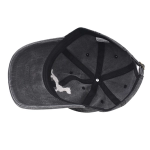 Detail of the 100% cotton washed baseball cap interior with stitching and metal buckle