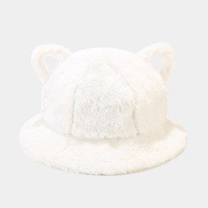 Detail shot of the white plush faux fur bucket hat featuring cute bear ear decorations