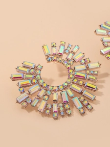 Close-up of rose gold sunflower earrings with iridescent rhinestones in a C-shape design