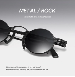 Macro shot of black punk oval sunglasses featuring a metallic frame and steampunk aesthetic
