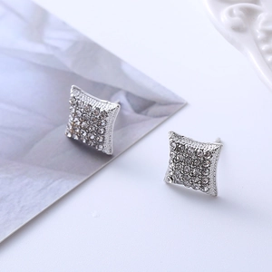 Macro shot of silver square stud earrings featuring micro-pave cubic zirconia crystals