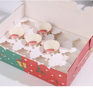 Close-up of 12-hole Christmas cupcake box with clear window and festive Santa patterns