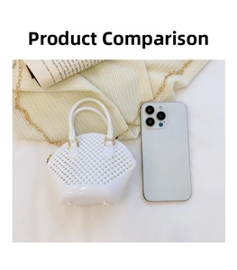 Detailed size comparison of a mini white shell pearl bag with a smartphone and chain