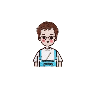 Close-up of cute cartoon boy embroidery patch with fine stitching for DIY clothing