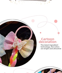 Detail of pink sequin bow hair tie with colorful braided extension and butterfly accent