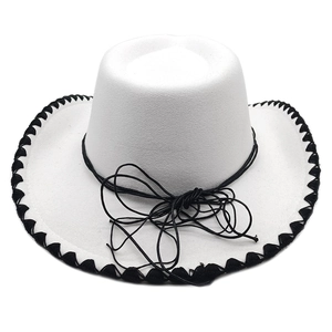 Detail of white felt cowboy hat featuring black braided trim and cord on wide brim