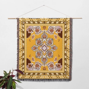 Macro shot of bohemian mandala tapestry with colorful fringes and woven fabric texture