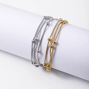Three-layer stainless steel snake chain bracelet with beads in 18K gold and silver plating