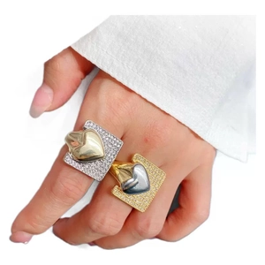 Exaggerated two-tone heart rings with gold and silver plating and sparkling cubic zirconia