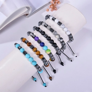 Detail of adjustable 8mm natural stone bracelets set with turquoise and tiger eye beads