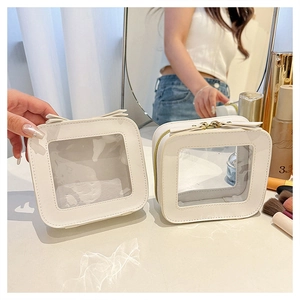White transparent cosmetic bag detail view showing clear window and smooth zipper design
